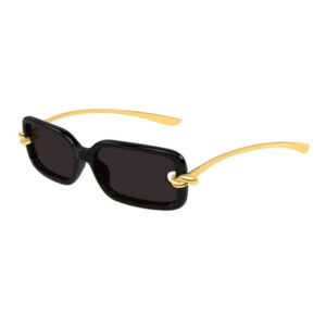 Black rectangular sunglasses with dark lenses and gold-tone metal arms with decorative rings at the hinges