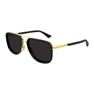 Pair of black-lensed sunglasses with a gold metal frame and black temples on a white background, fashion eyewear.0