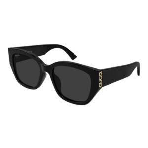 Black cat-eye sunglasses with dark lenses and a gold Gucci logo on the temple.