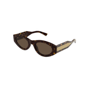 Tortoiseshell cat-eye sunglasses with dark lenses and a beige glitter stripe on the temples