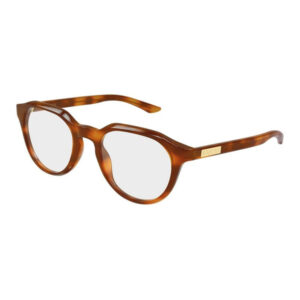Tortoiseshell Gucci eyeglasses with rounded rectangular frames and gray lenses; Gucci logo on the temple tail.