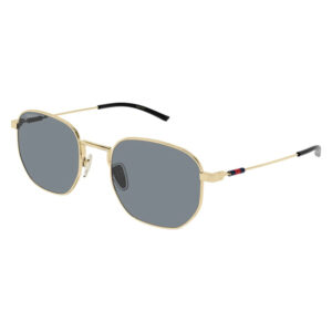 Gold-tone metal sunglasses with dark gray lenses and slim temples, Gucci branding on the lens and temple tip accents of red and blue.