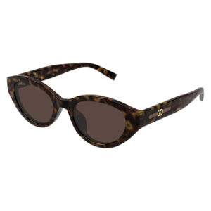 Tortoiseshell cat-eye sunglasses with dark lenses and Gucci logo on the temple, featuring a green-red-green stripe.