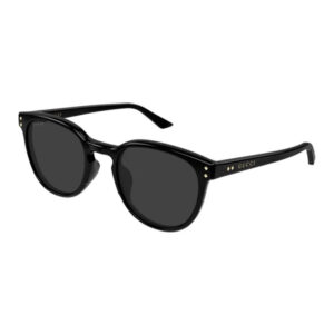 Black Gucci sunglasses with dark lenses and Gucci logo on the temple to the side of the arm.