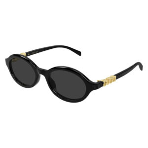 Gucci black round sunglasses with gold accents on the temples.