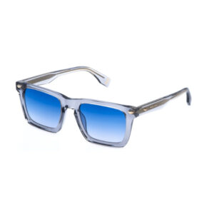 Sunglasses with blue gradient lenses and a transparent gray frame, angled to the left. The temples have a subtle pattern.