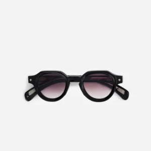 Black round-framed sunglasses with pink gradient lenses on a white background.