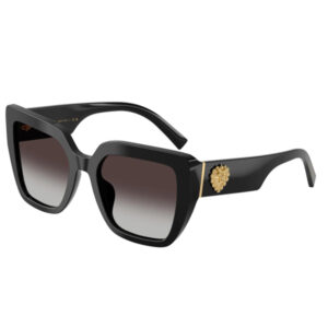 Black oversized sunglasses with gradient lenses and a gold crest emblem on the temple, stylish and luxurious.