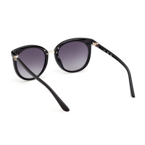Black cat-eye sunglasses with gradient gray lenses on a white background, showcasing glossy black frames and gold hinge accents.