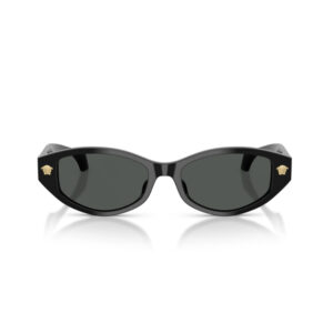 Black cat-eye sunglasses with dark lenses and gold crest emblems on the corners, resting on a white reflective surface.