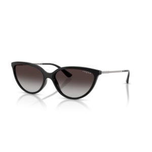 Black cat-eye sunglasses with gradient brown-to-clear lenses and slim metal temples, Vogue branding on lens.