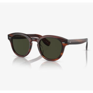 Tortoiseshell sunglasses with dark lenses shown at an angle, reflecting on a white surface.